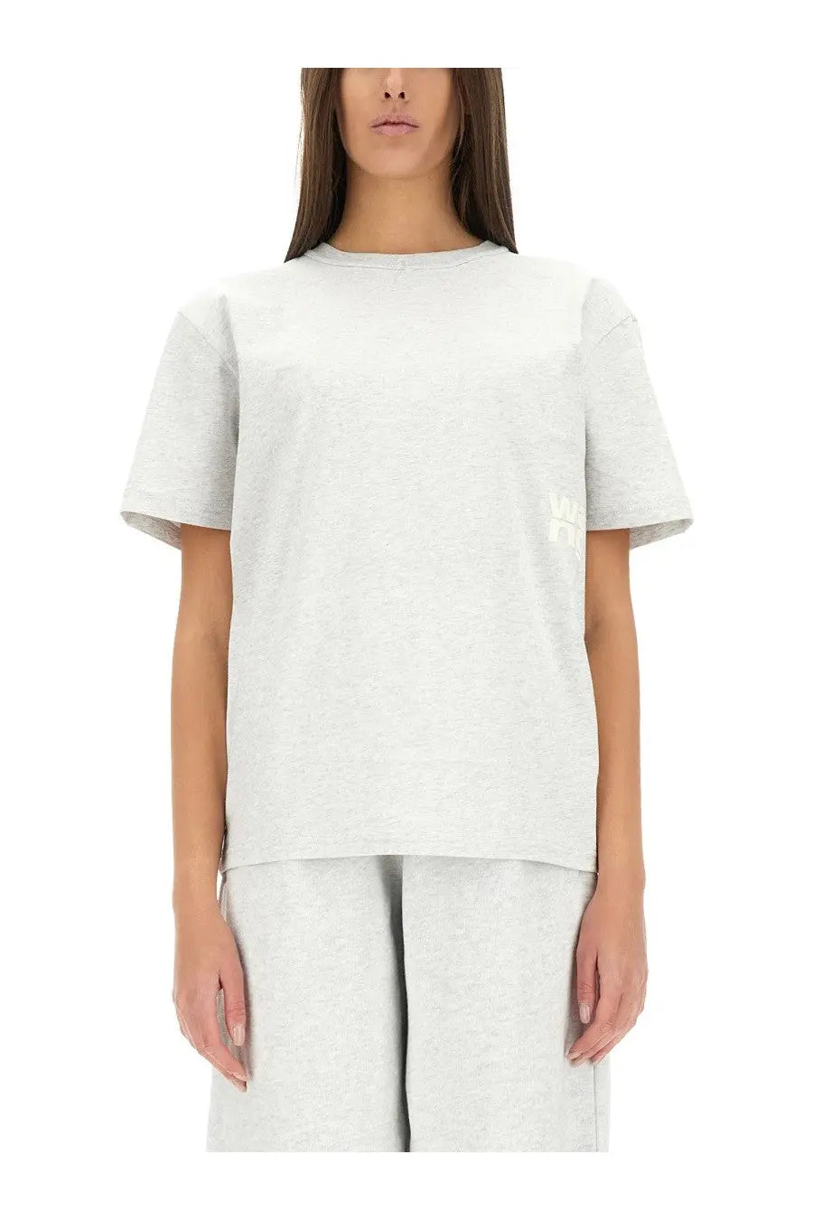 Alexanderwang women’s essential shirt grey is a soft heathered light gray cotton t-shirt with a subtle embroidered logo