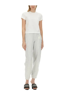 Light gray sweatpants with subtle embroidered logo on left thigh complementing alexanderwang women’s essential shrunk shirt white