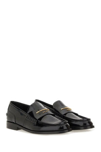 Alexanderwang women’s black patent leather moccasin carter loafers with gold tone branding on the front