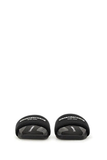 Black alexander mcqueen slide sandals with white branding on the nylon strap for women