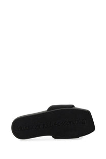 Black alexander wang women’s nylon slide sandal with textured rubber sole and embossed brand logo
