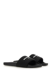 Black alexanderwang womens nylon slide sandals with textured fabric strap and white embroidered branding