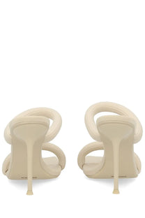 Cream-colored alexanderwang women’s sandal julie pink with sculpted leather and high stiletto heel with abstract loop design