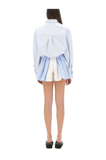 Alexanderwang women’s short blue striped overalls paired with a light blue and white striped long-sleeved shirt with relaxed fit