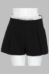 Alexanderwang women’s black pleated shorts with white elastic waistband featuring gray alexanderwang logo