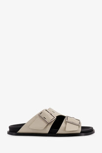 Alohas women’s alba low beige leather slide sandal with two silver buckle straps and black rubber sole