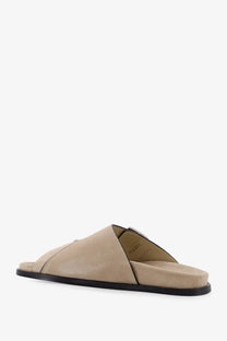 Alohas women’s alba beige suede slide sandal with black rubber sole and minimalist design front view