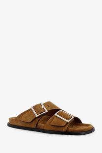 Alohas women’s alba suede slide sandal in tan with two silver buckle straps and black rubber sole