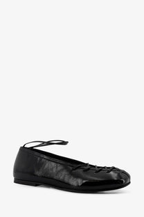 Alohas women’s bumi patent leather ballet flat in black with lace-up detailing and a thin ankle strap