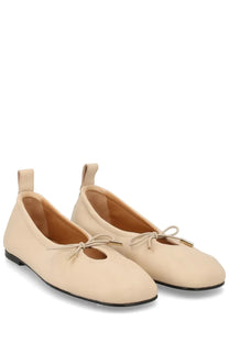 Alohas women’s dancer rosalind yellow beige leather ballet flats with bow at toe and small pull tab on heel back view
