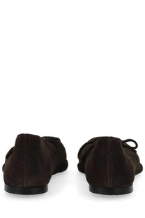 Dark brown suede ballet flats with a small bow at the back shown from the back by alohas women’s dancer sway brown
