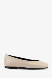Cream-colored leather Alohas women’s Katia ballet flat with sleek minimalist design and black sole