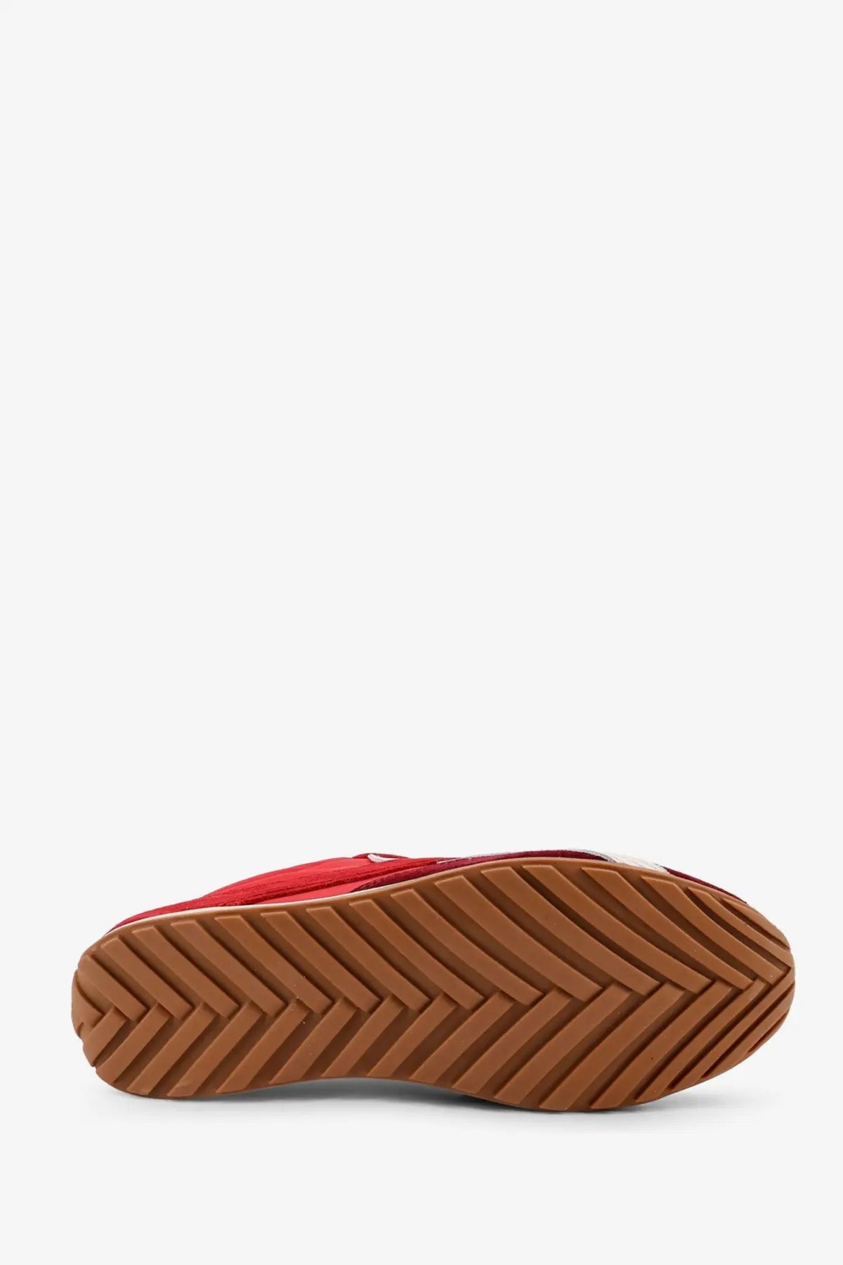 Alohas women’s red nylon and suede slip-on sneaker with a brown rubber sole and chevron tread pattern