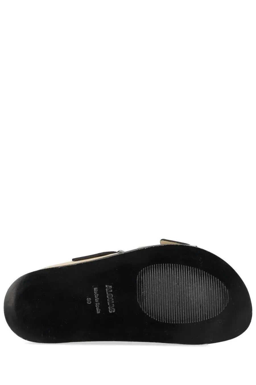 Black rubber sole with textured grip and moros label on alohas women’s sandalo alba beige sandal back side
