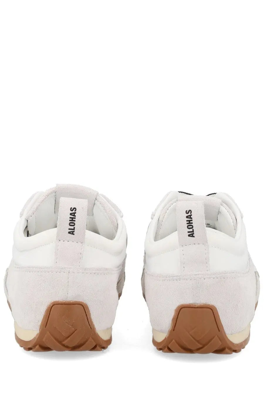 Back view of alohas women’s sneaker tb304 white with white suede upper tan rubber soles and aloha label on heel