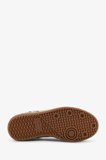 Brown rubber sole with wavy tread and circular grip dots featuring sunny label on alohas women’s tb ponyskin sneakers beige
