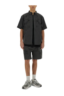 Alpha Industries men’s grey short-sleeved utility vest with zippered pockets and front zipper closure