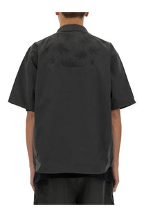 Alpha Industries men’s laser cut grey short sleeve shirt showing back with dark gray subtle textured pattern
