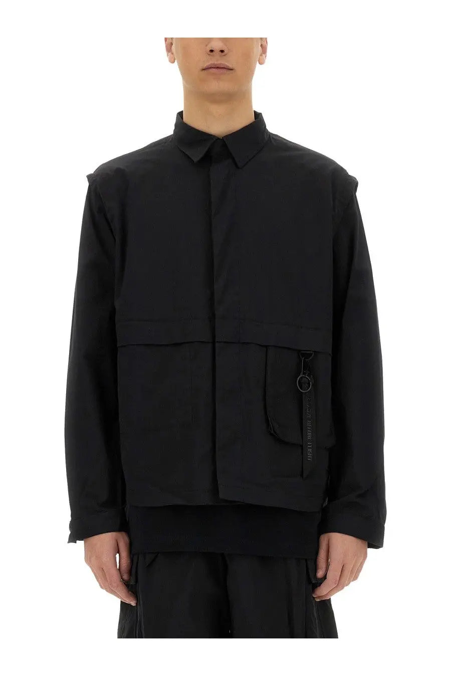 Alpha Industries men’s black utility overshirt with structured collar, front zipper, and large patch pocket with metal ring pull