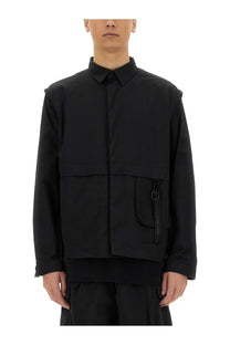 Alpha Industries men’s black utility overshirt with structured collar, front zipper, and large patch pocket with metal ring pull
