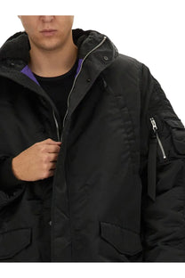 Alpha Industries unisex long bomber jacket black with hood lined in plush fleece silver zippers and multiple pockets including arm patch pocket