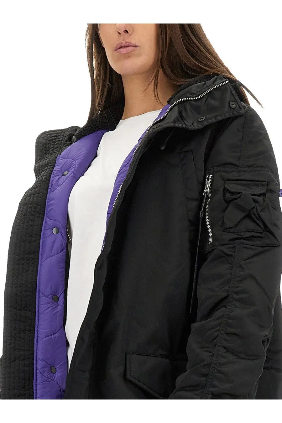 Alpha industries unisex long bomber jacket black with black quilted exterior, vibrant purple lining, and gray fleece collar