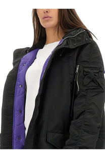 Alpha industries unisex long bomber jacket black with black quilted exterior, vibrant purple lining, and gray fleece collar