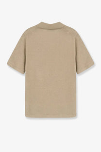 Beige short-sleeved polo shirt with classic collar and subtle seam detailing made of linen and cotton blend by Alpha-Studio