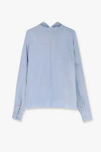 Alysi women’s cotton shirt cielo in soft light blue silk with subtle sheen and elegant oversized long sleeves