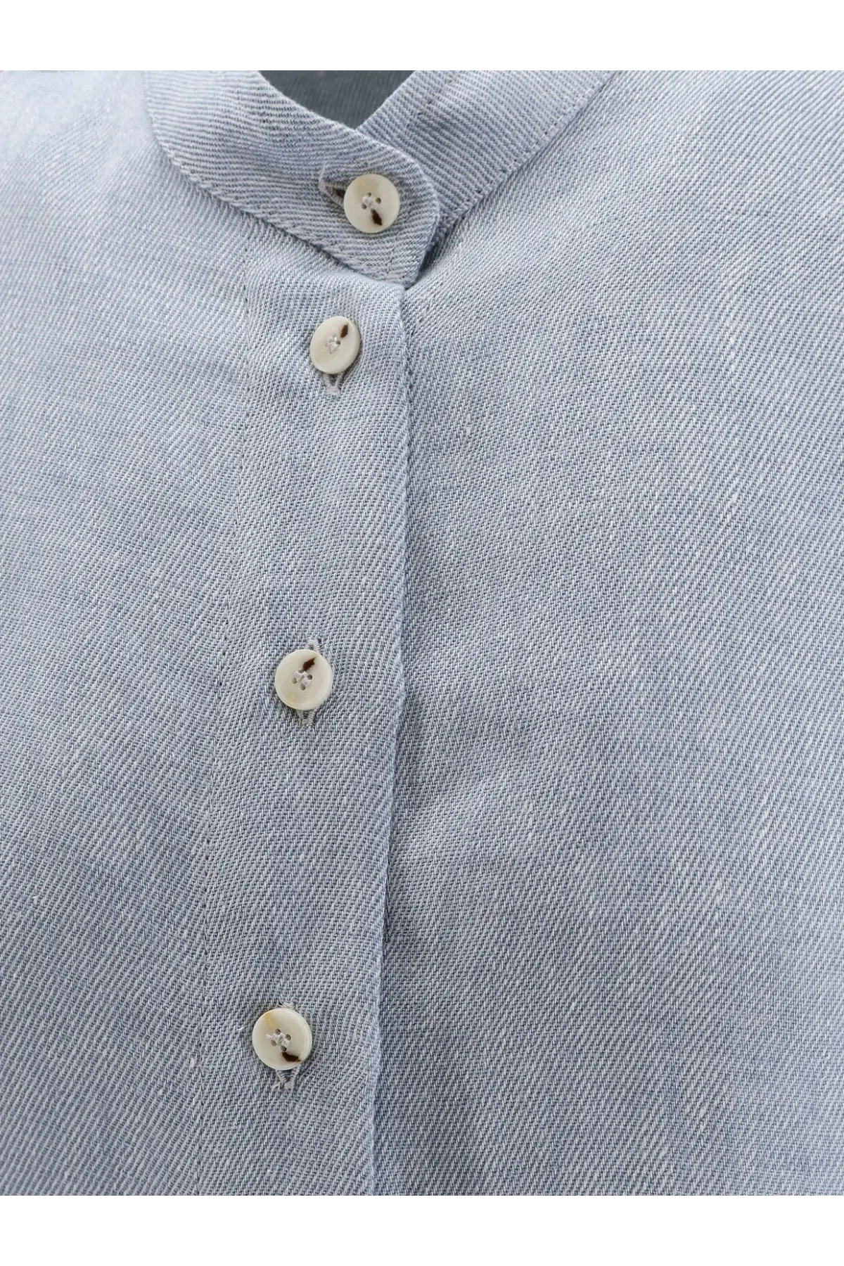 Light blue textured cotton alysi women’s élavé linen shirt with cream-colored buttons front view