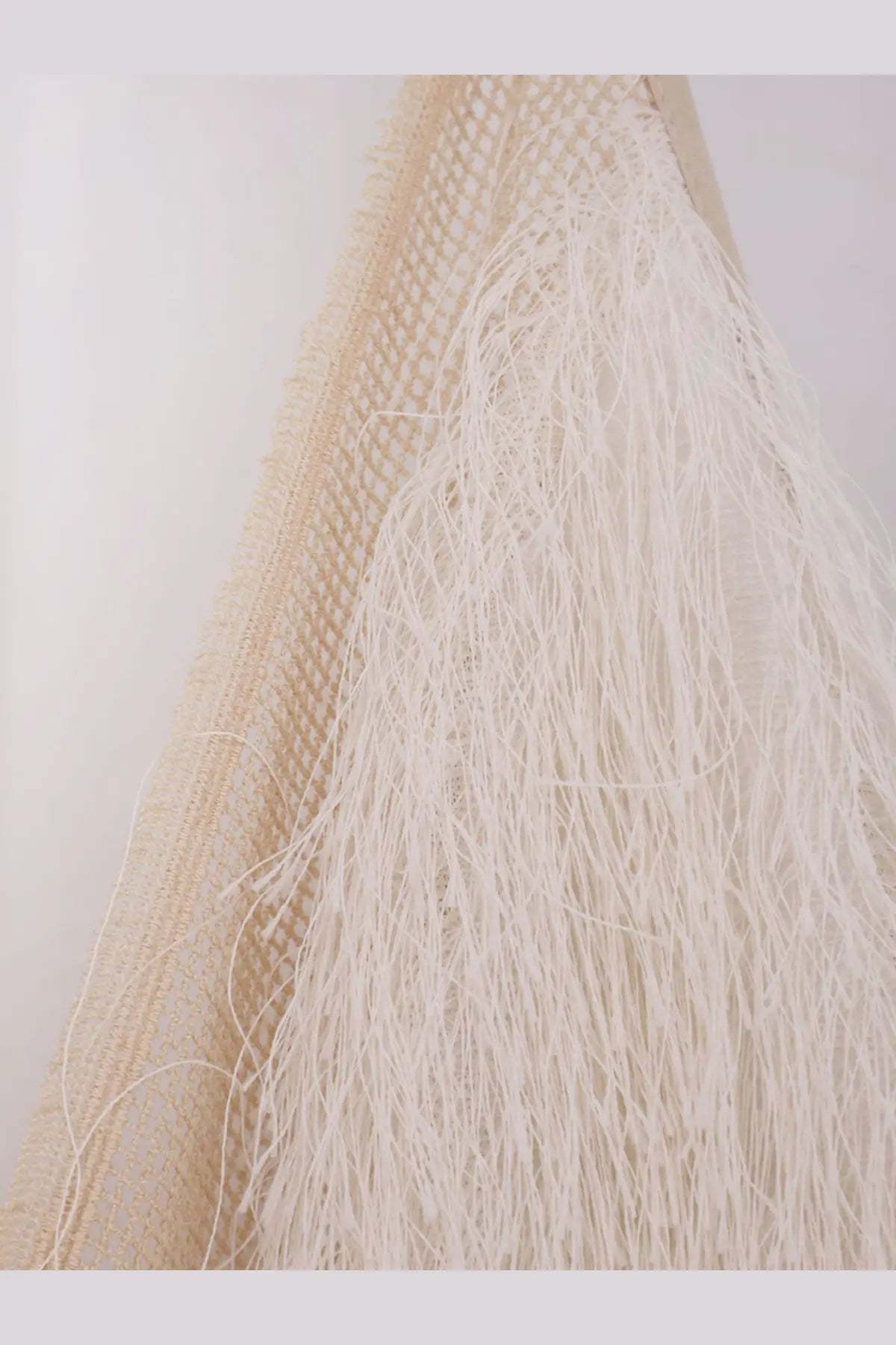 Alysi women’s cream-colored mesh tote bag with long flowing white fringe in fringed top meringa style