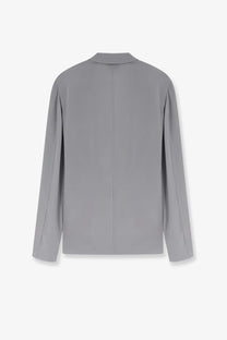 Alysi women’s loose silk blazer grey shown from the back with smooth fabric and a subtle vertical seam