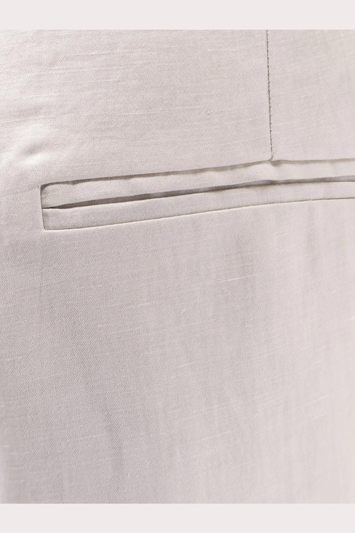Alyss women’s light gray lyocell and linen trousers with a neatly stitched pocket and clean precise seams