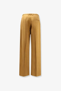 Tan alysi women’s lyocell and linen wide-leg trousers with sleek tailored fit and subtle back pleats shown from the back