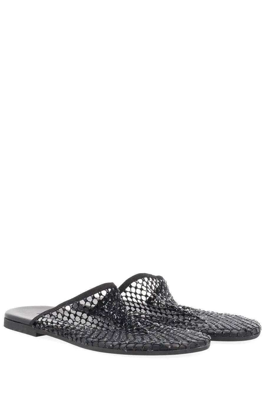 Alysi women’s mule shoe black with woven open-knit mesh upper and flat rubber sole shown from the back side