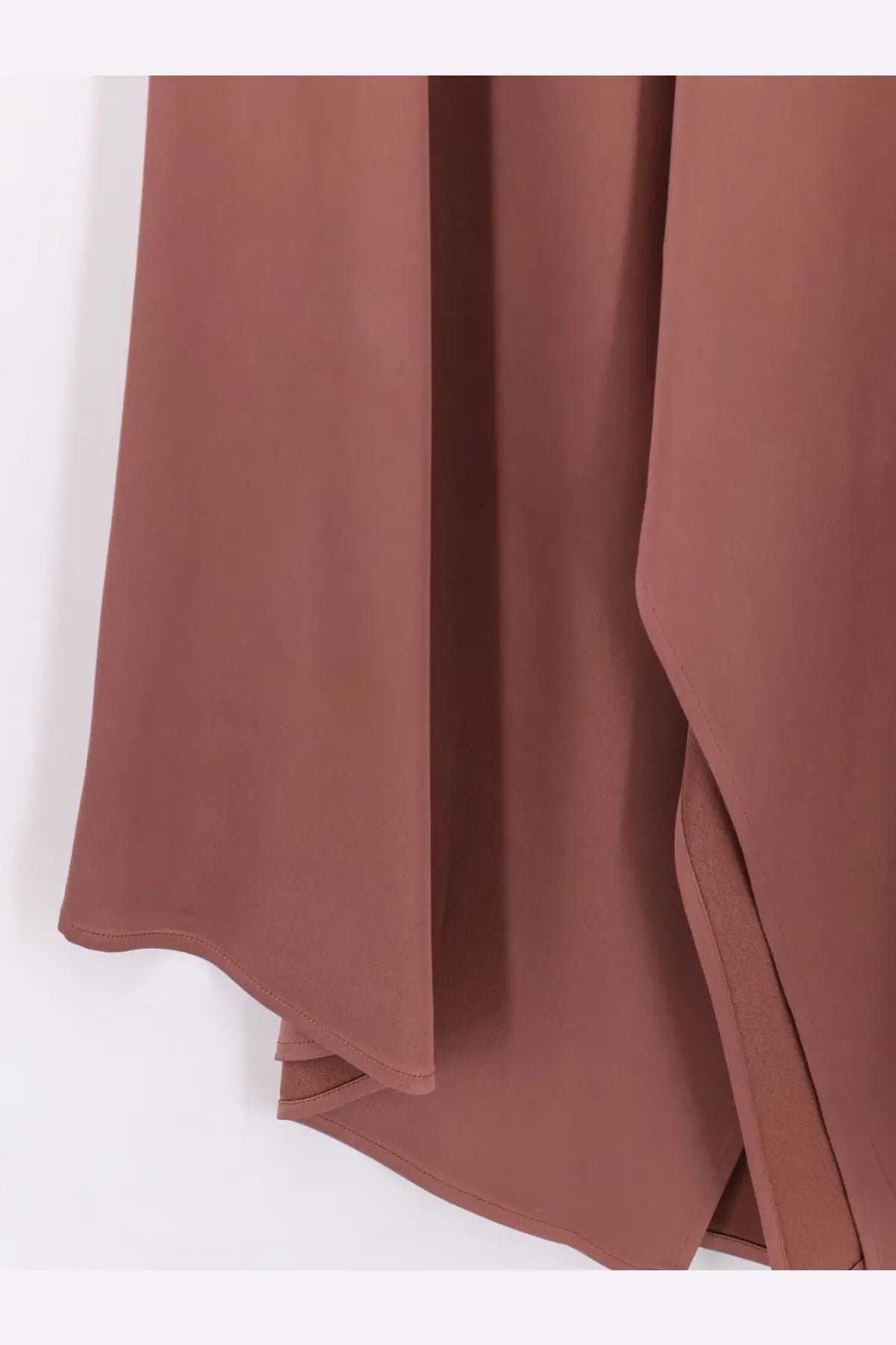 Alysi women’s satin skirt blue with a flowing rust-colored chiffon overlay featuring soft drape and subtle seam details