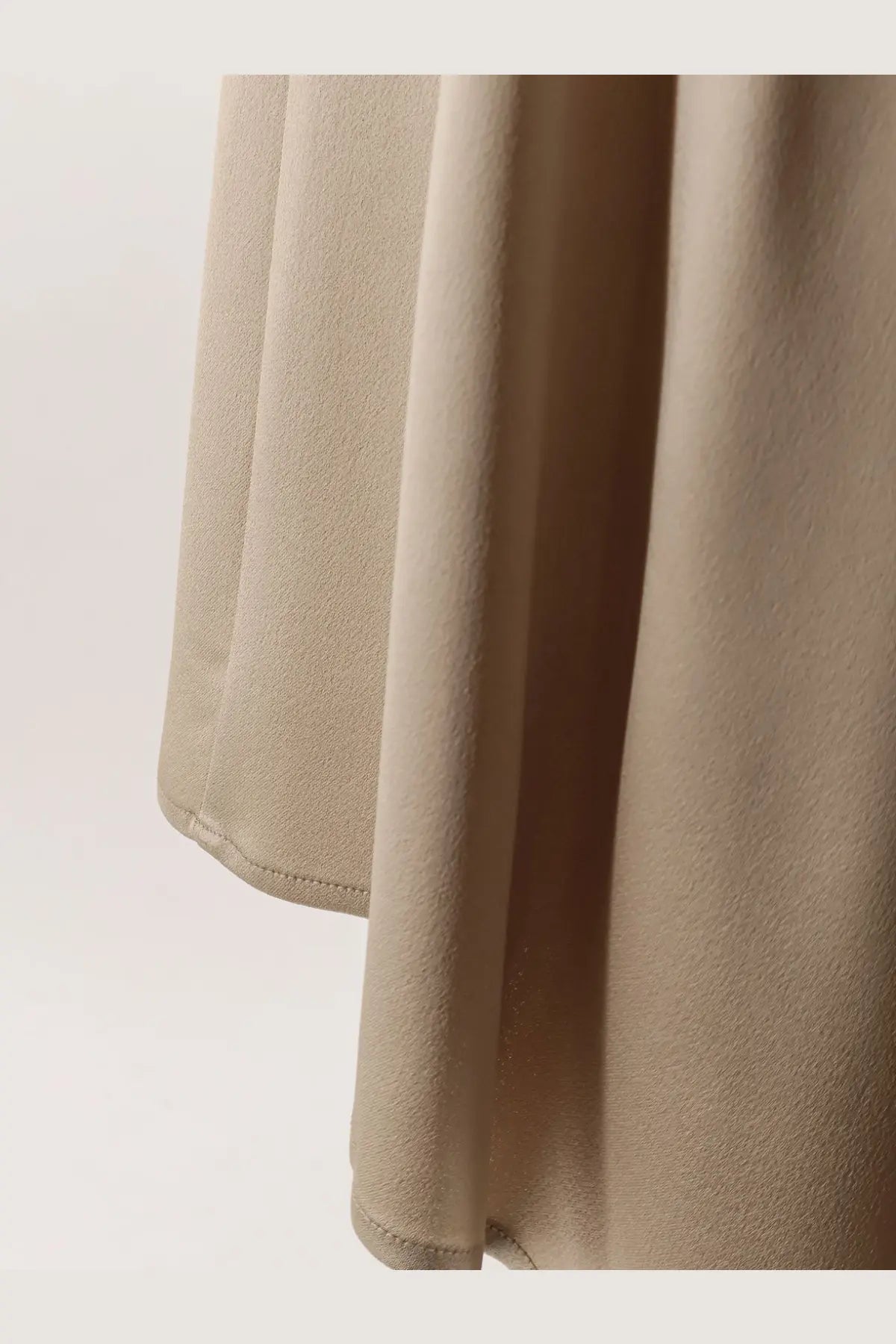 Alysi women’s beige satin skirt with smooth flowing drape and neatly stitched hem in satin material