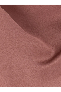 Alysi women’s satin top in blue shown with a soft dusty rose-colored fabric and smooth textured weave