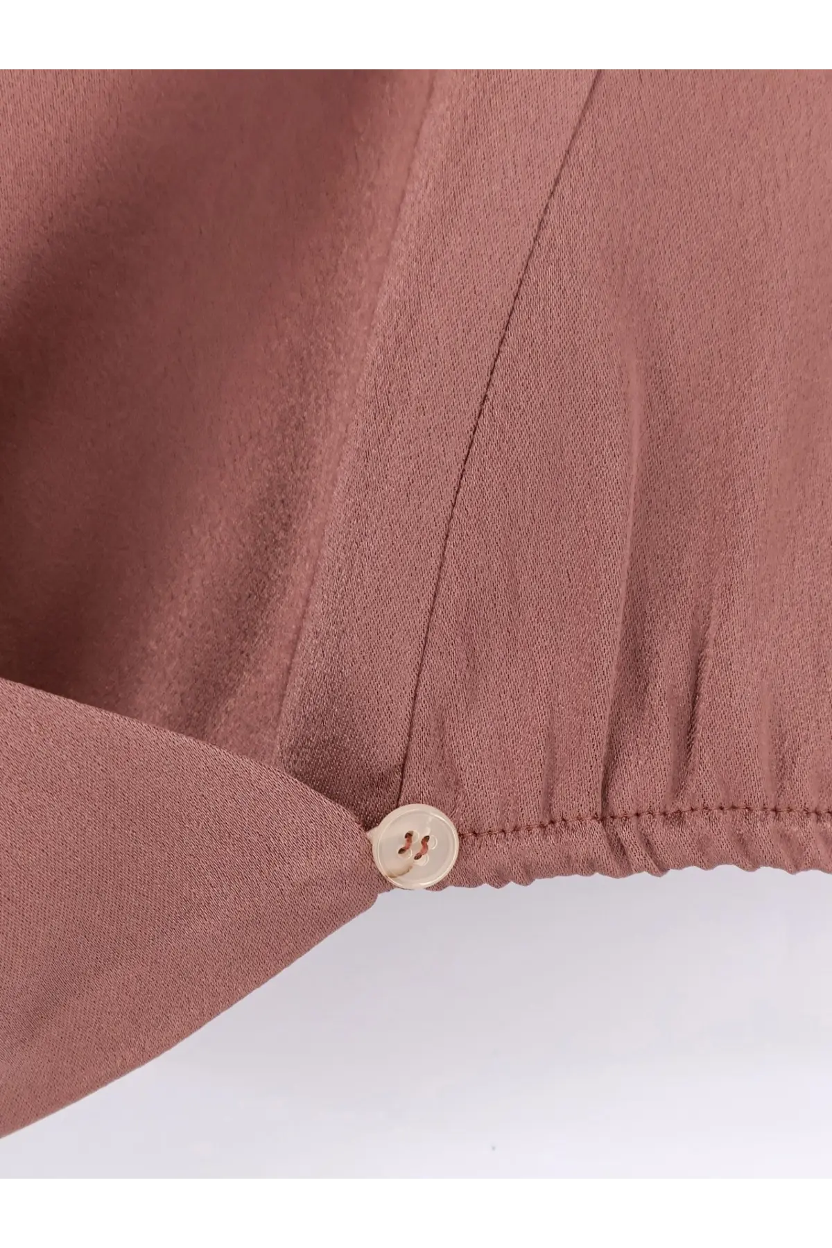Alysi women’s satin top blue with a soft mauve textured blouse and round beige button at the cuff