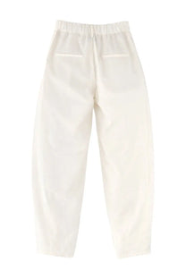 Back view of alysi women’s white silk tailored pants in a relaxed fit with elastic waistband and two back pockets