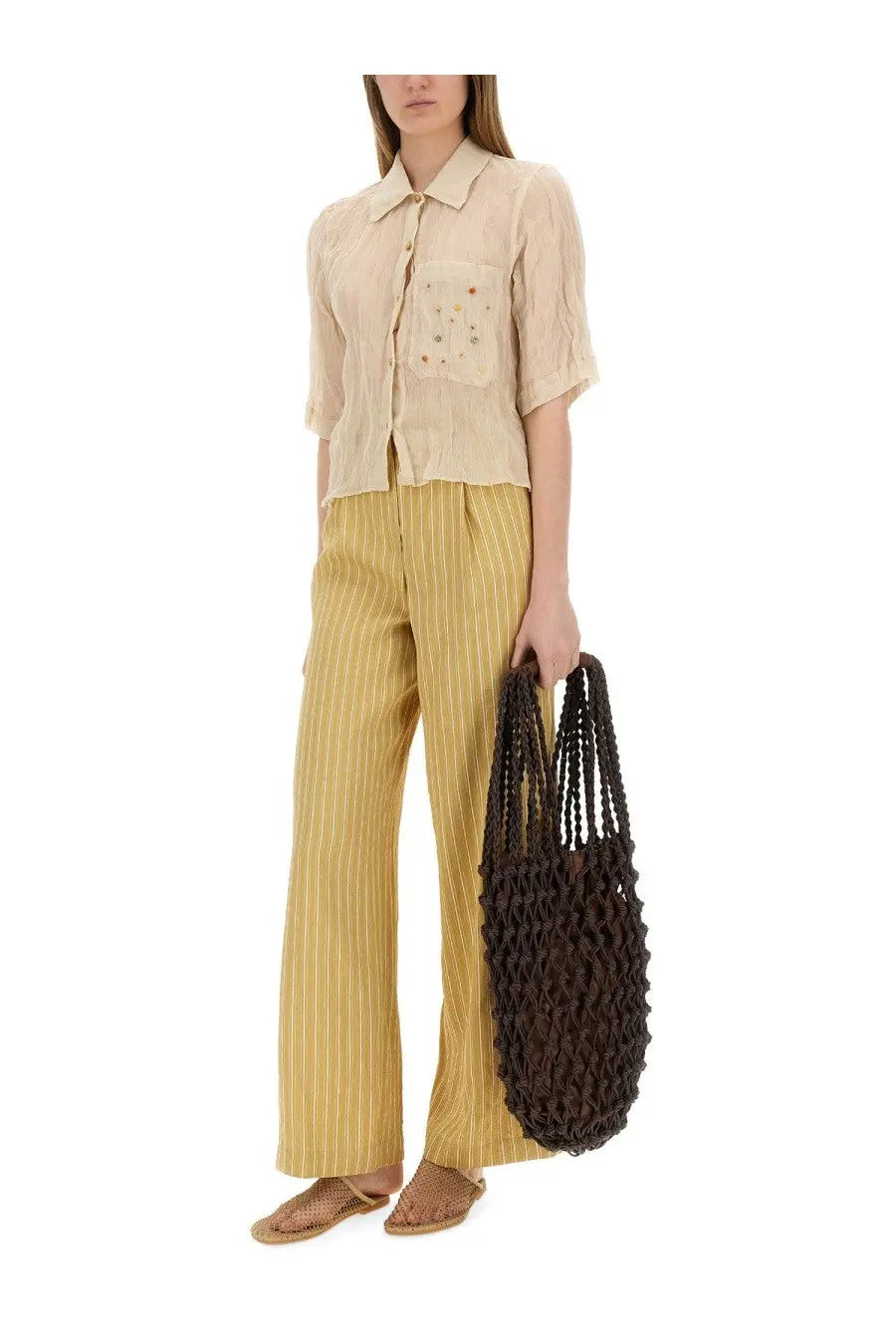 Brown woven tote bag with textured braided design paired with alysis beige striped satin tailored pants