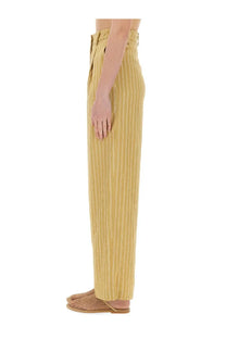 Alysi women’s high-waisted striped satin tailored pants in mustard yellow with thin white vertical stripes