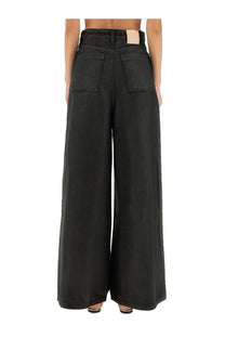 Back view of alysi women’s super flare denim pants in black high waist wide-leg denim with two back pockets