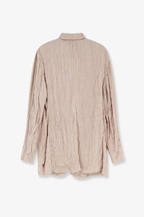 Beige textured long-sleeved shirt with subtle vertical ribbed pattern complementing alysi women’s wrinkled viscose pink blazer