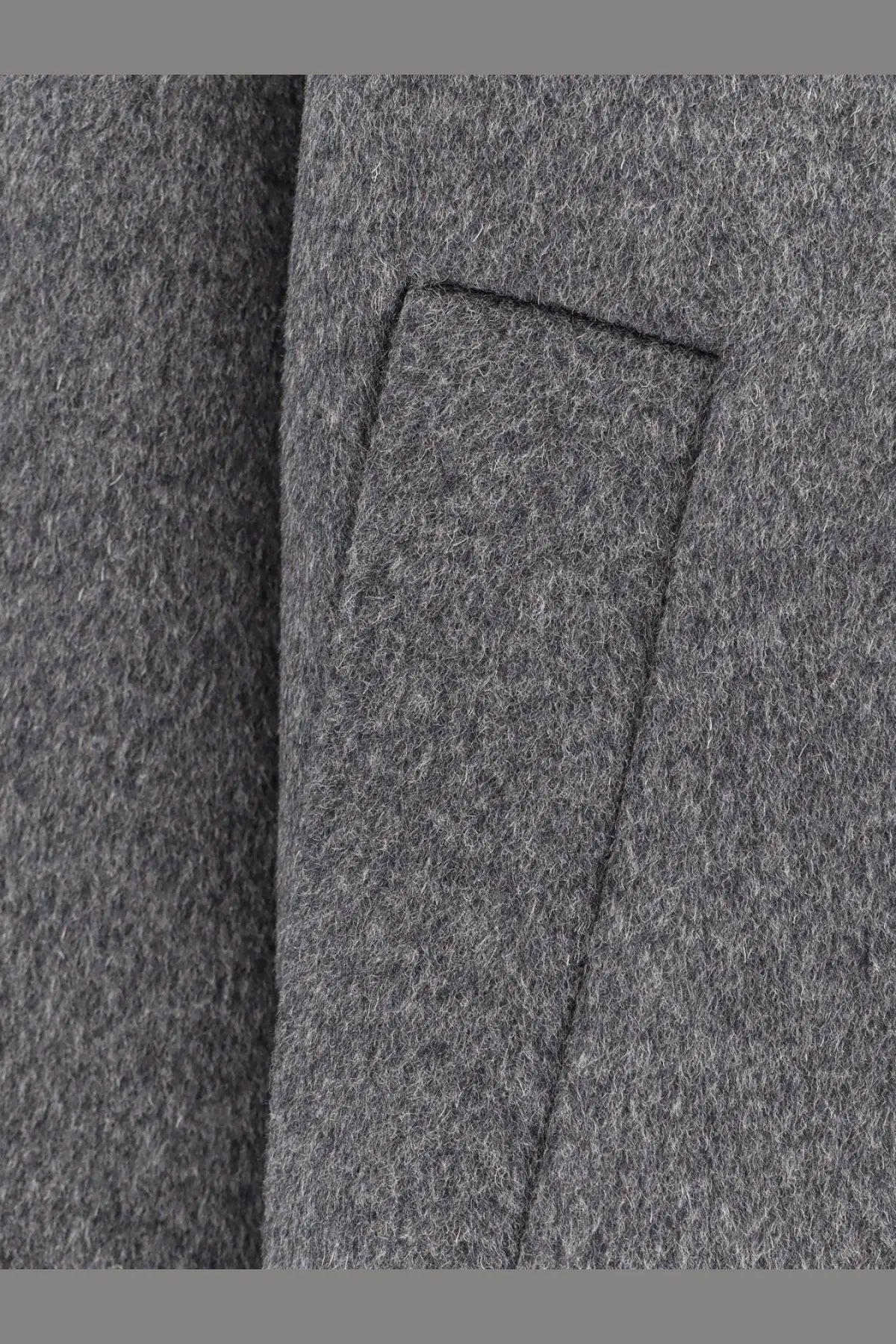 Gray wool coat pocket with subtle textured weave and neatly stitched edges on amaranto men’s outdoor wool coat gray