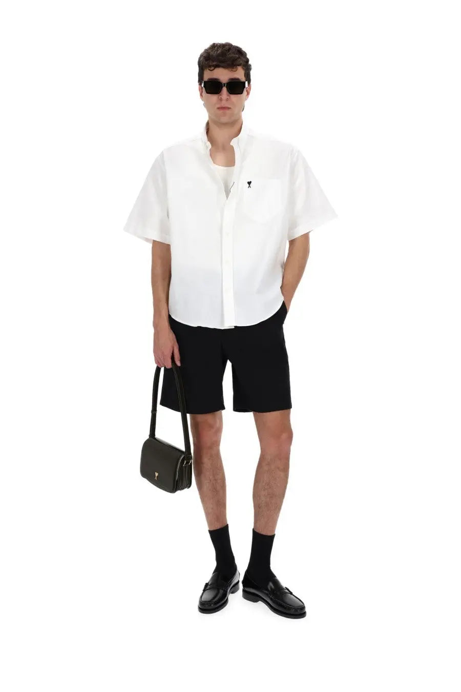 Ami paris men’s camica con ricamato white featuring a black leather crossbody bag with gold-tone hardware and minimalist design