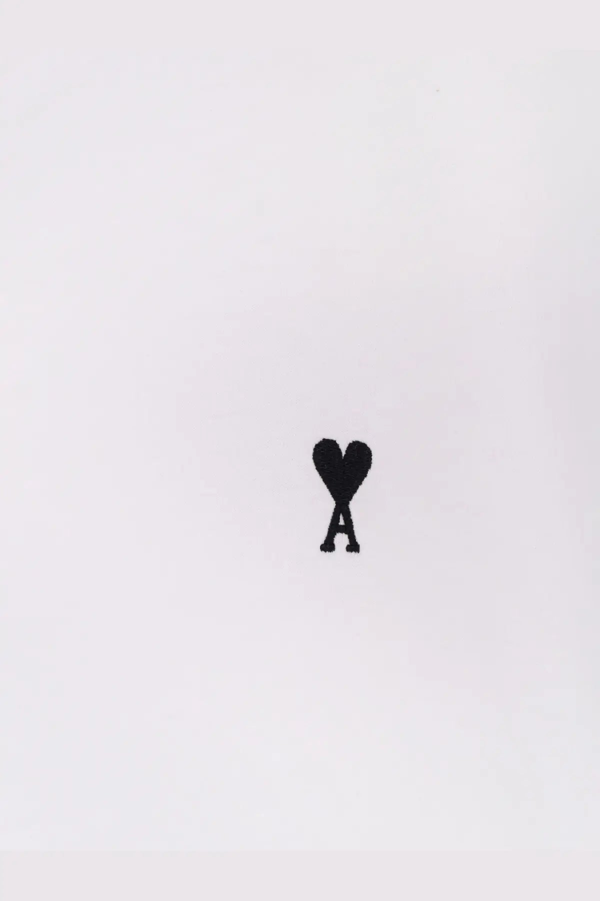 Ami Paris men’s white cotton shirt with black embroidered heart shaped logo and stylized a on the front