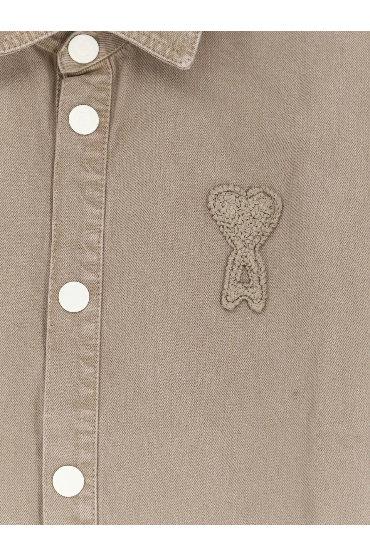 Beige cotton button-up shirt by ami paris featuring a crocheted heart-shaped logo patch on the chest