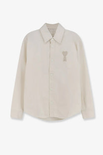 Cream-colored cotton long-sleeved button-up shirt with heart-shaped embroidered patch on left chest by ami paris