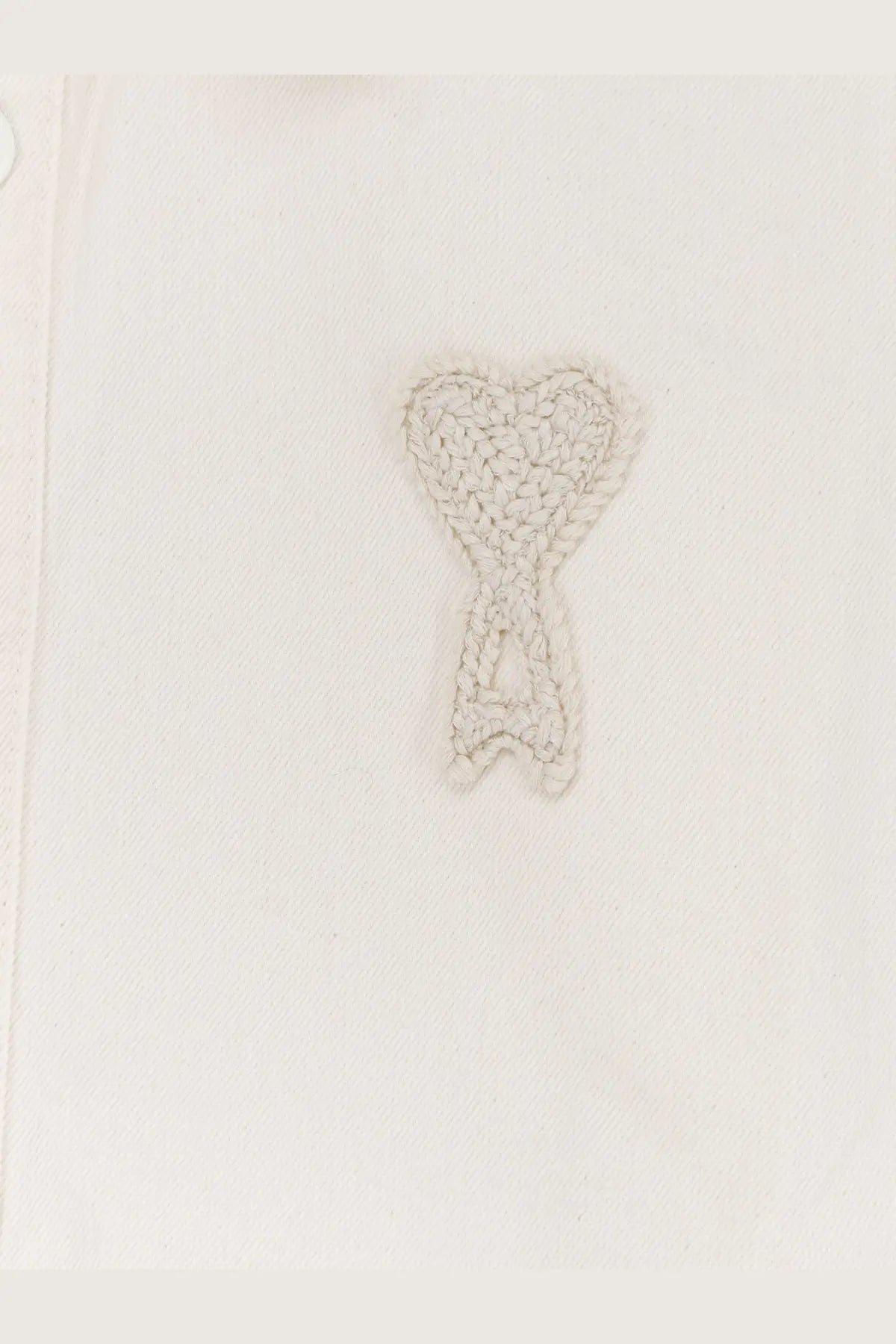 Ami paris men’s ami de coeur white cotton shirt with a delicate light gray crocheted heart emblem stitched on white fabric
